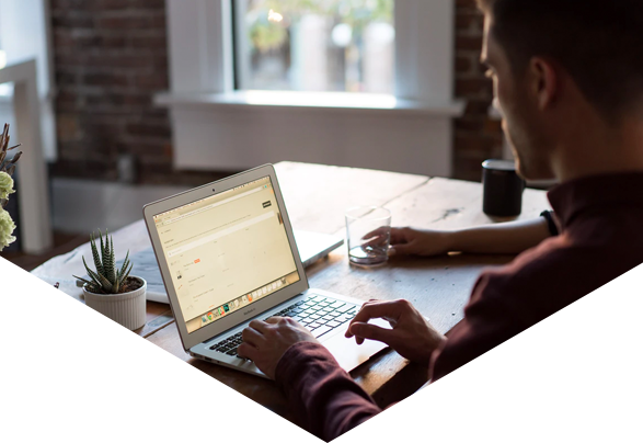 Man using laptop at desk