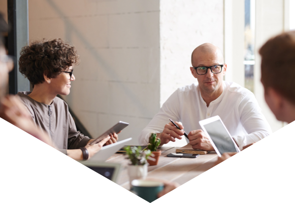 People sat around table in meeting