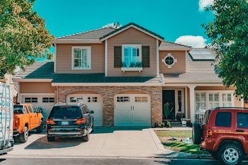 House with cars parked outside