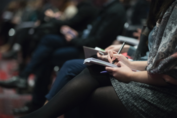 Audience taking notes