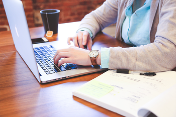 Person using laptop at desk