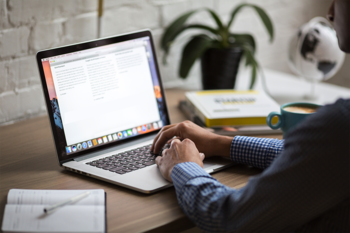 Person using laptop at desk