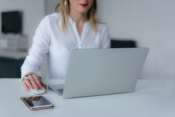 Woman at desk using laptop