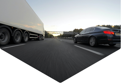 Truck and car driving on highway