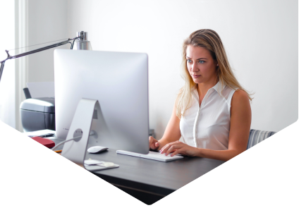 Woman sat at desk working on computer